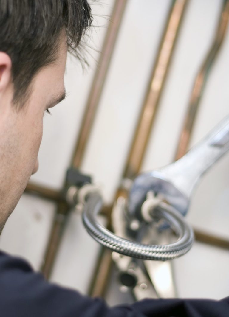 Engineer fixing pipe